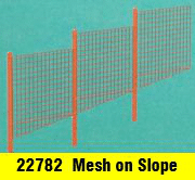 modern mesh fence on a slope N gauge